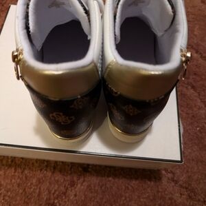 Guess wedge shoes.
